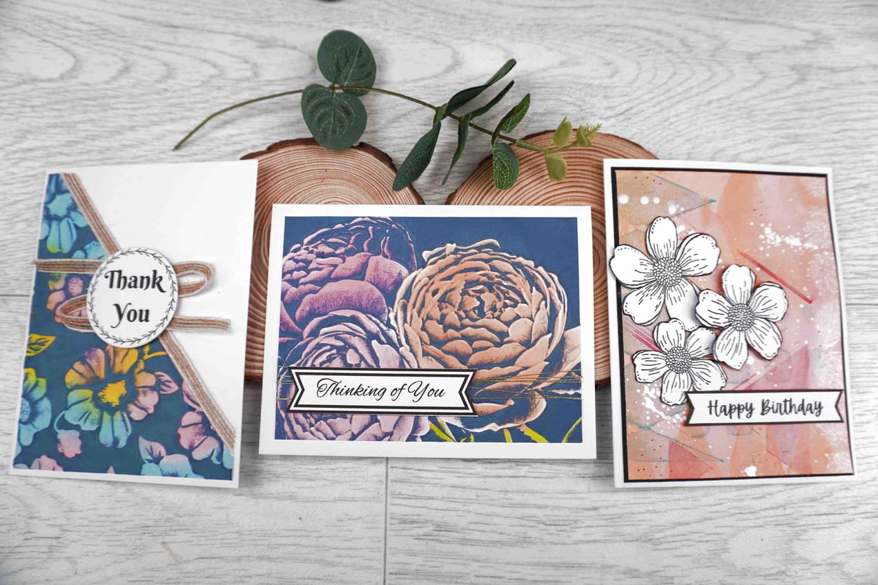 Three beautiful cards featuring Natasha Foote Creative sentiments staged on wood rings with foliage